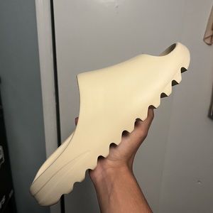 Size 13 Yeezy Slides Bone White Color way fits best for sizes 11.5-12